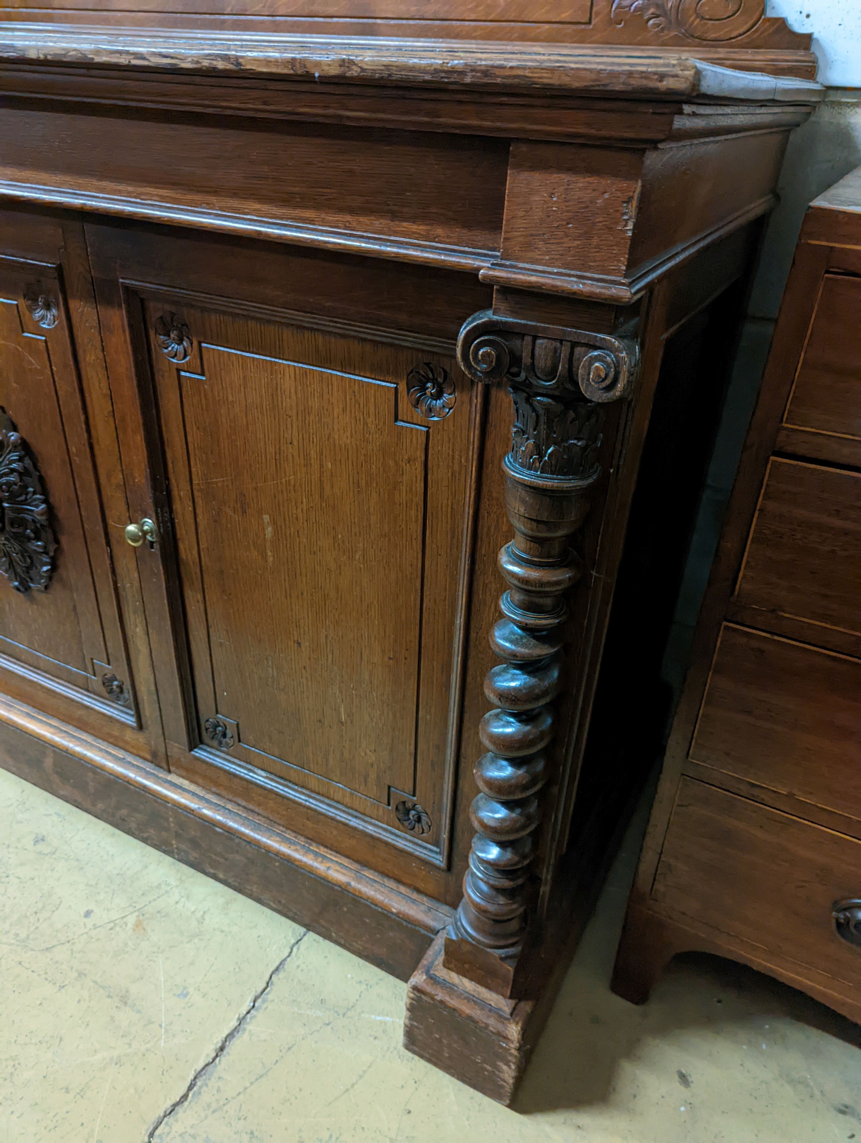 A Victorian oak side cabinet, length 150cm, depth 62cm, height 130cm